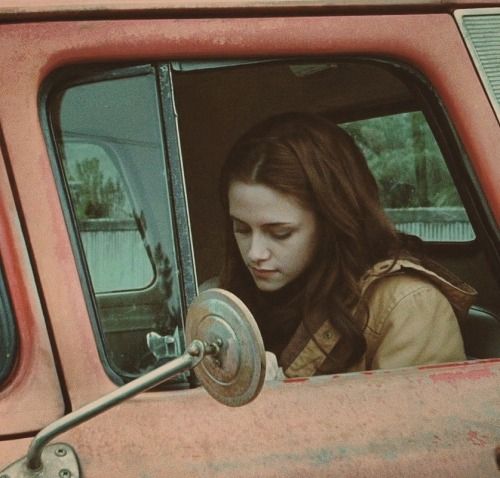Bella Swan inside of her red truck in Twilight